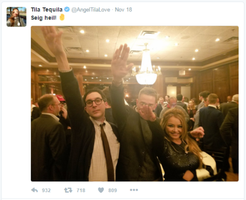 two white men and an Asian woman doing a Sieg Heil salute