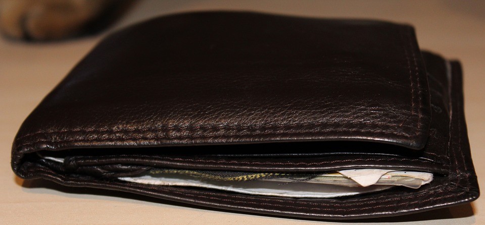 wallet with money sticking out