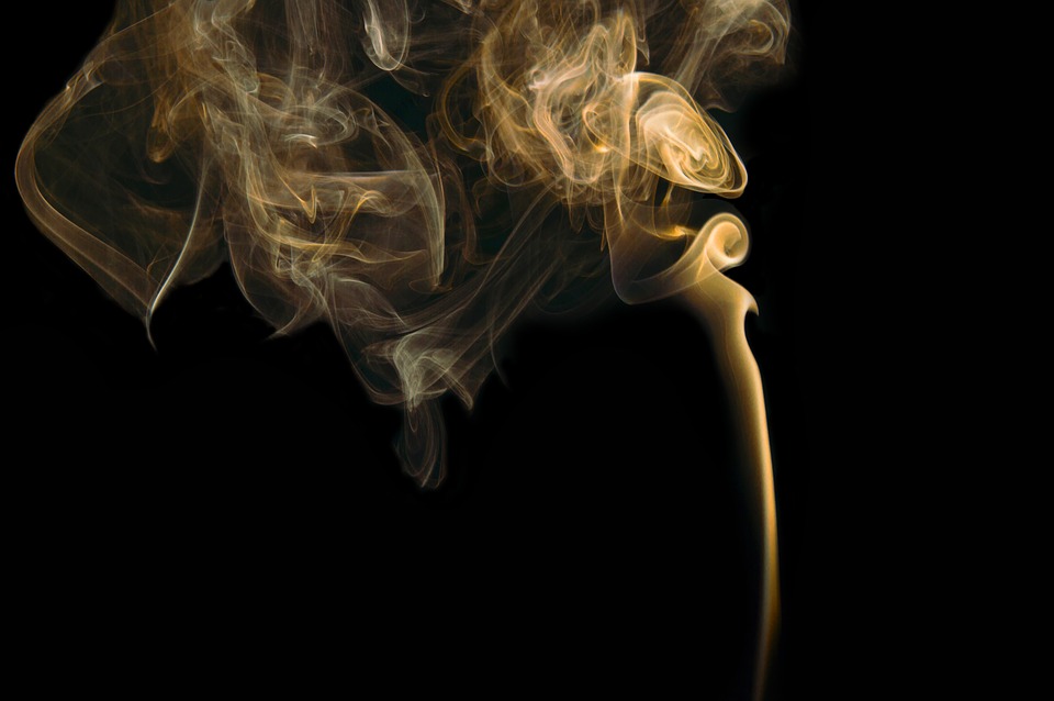 smoke rising in the darkness